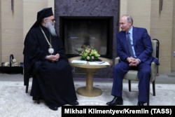 Іоанн X, православний патріарх Антіохійський, і президент Росії Володимир Путін. Москва, 4 грудня 2017 року